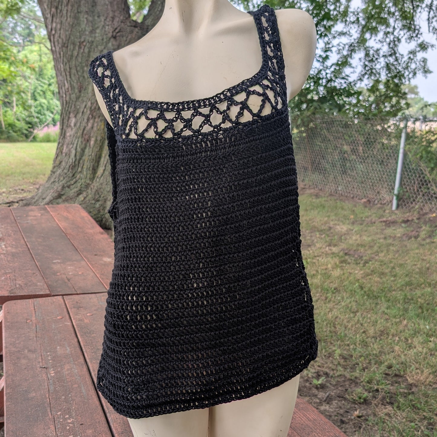 Charcoal open-mesh handmade crochet top on a mannequin